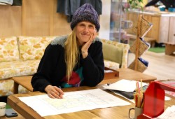 Megan Francis, Redd Fish director of outreach and education, eyes the floorplan for the budding Stewardship Centre in the works at 1728 Peninsula Rd. in Ucluelet. Construction begins this winter with a June 2026 completion target.   