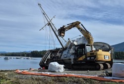 Due to the lack of space and the absence of a boat lift at Tofino’s harbour, Rugged Coast towed the Mikley down the peninsula to Ucluelet where it was bridled with rope, pulled to land on the highest tide with an excavator and demolished; some parts were salvaged and recycled, but all the rotting wood went to the West Coast Landfill. (Ben Boulton photo)