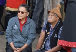 Tla-o-qui-aht elder Moses Martin sits with Ahousaht Ha'wilth Maquinna, Lewis George.