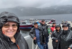 The Crabshack crew waiting in heavy rain for hikers, from left: Shelley Edgar, Carl Edgar, Leon Edgar, Krissy Edgar, Ryan Edgar and Darci Edgar. (Submitted photo) 