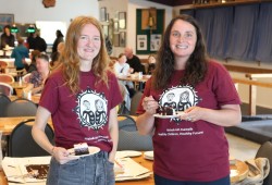 Nuu-chah-nulth Tribal Council (NTC) community-based researchers Maddie Haynes, left, and Skye McEwan pop in for a piece of Legion birthday cake. The research team was conducting surveys in the Legion basement for the Hishuk-ish Tsawalk: Healthy Children, Healthy Futures project. 