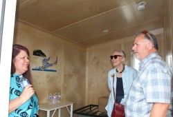 Port Alberni Friendship Center Executive Director Cyndi Stevens (left) stands in one unit of the Walyaqil Tiny Shelter Village with Carolyn Bennett, who was then Canada's minister of Mental Health and Addictions, and Courtenay-Alberni MP Gord Johns on July 4. (Eric Plummer photo)