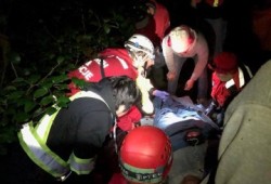 Emergency responders prepare Atleo for transportation down the mountain. (Tim Webb, West Coast Search and Rescue Society photo)