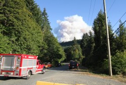 As Port Alberni residents watched a rising plume of smoke on Aug. 11, trucks from the area's fire departments rushed to the scene south of the small city. (Eric Plummer photo)