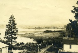 Before the land was dredged for the sawmill in 1934, tidal mudflats existed, part of the Somass estuary. Pictured is First Avenue, looking north in 1907. (Leonard Frank/Alberni Valley Museum Photograph Collection PN01226) 