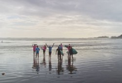 The Coastal Queer Alliance focuses on increasing representation for queer folks, as well as providing resources and opportunities for community connection. The CQA administer several queer-centred programs yearly and focuses its efforts on different 2SLGBTQI+ advocacy campaigns. Pictured are members of the alliance surfing. (Coastal Queer Alliance video still)