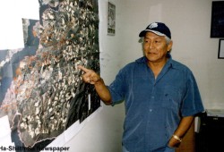 Robert Dennis stands with a map of Huu-ay-aht territory. (Ha-Shilth-Sa file photo)