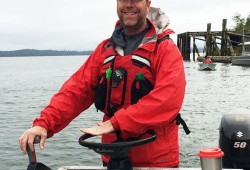 Sean Rogers navigates a vessel during Ocean Networks Canada operations off the coast of Vancouver Island.