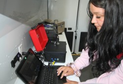Brianna Rai, the NTC’s harm reduction coordinator, operates a new drug testing machine in a van operated by the tribal council to support substance users. (Eric Plummer photo)