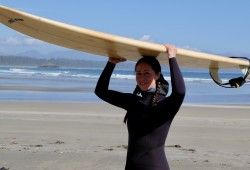 Tla-o-qui-aht language support worker Tsimka Martin is ready to take on the waves with the youth surf team.