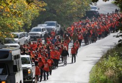 Walkers proceed down Mission Road on the Tseshaht reserve to begin the procession.
