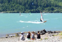A group of hikers take in the view at Nitinaht Lake, a saltwater fjord with a predictable wind season that runs from May to September. 