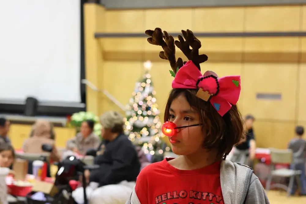 Wearing reindeer antlers, a blinking red nose, a red shirt and Christmas socks, Ash Campbell-Senay will celebrate 14 trips around the sun on Christmas Eve.