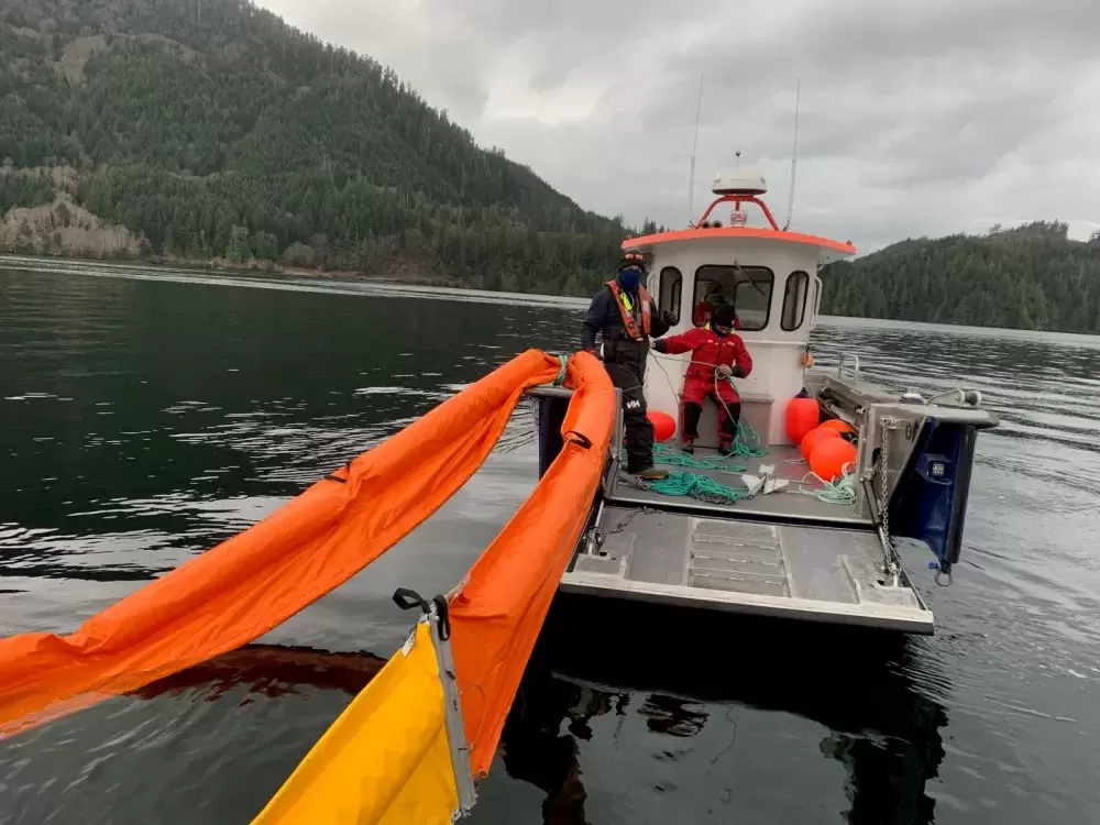Western Canada Marine Response Corporation crew prepares containment booms on a landing ramp on Bligh Island. (Unified Command photo)