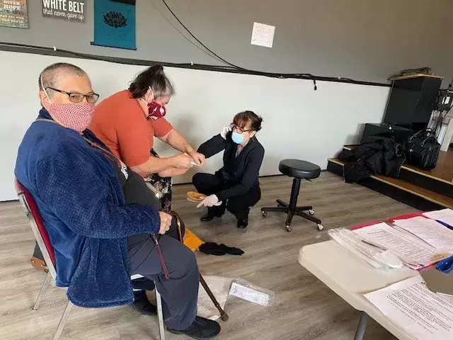 Delores and Maria Bayne receive a foot care assessment in Port Alberni.