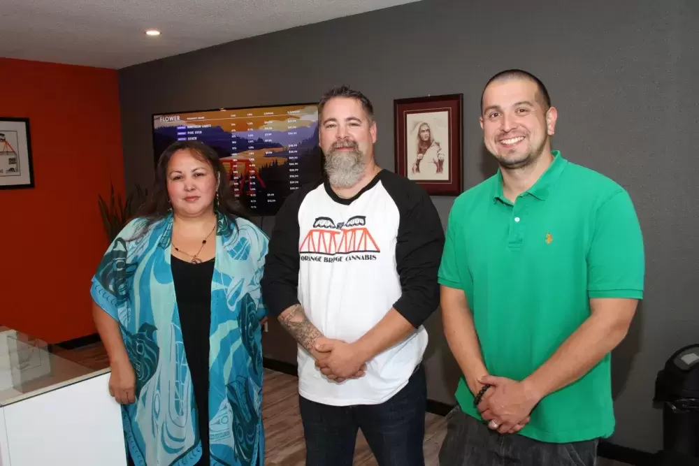 Assistant Manager Tammy Lucas(right),  Manager Ron Kyle and Tseshaht Chief Councillor Ken Watts stand in Orange Bridge Cannabis. (Eric Plummer photo)