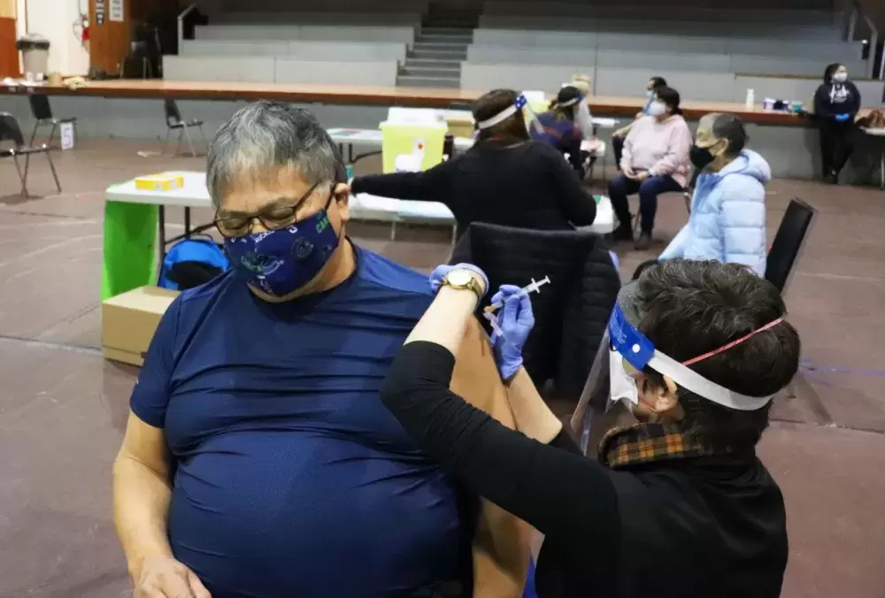 Joe Charleson Sr. was the first Tseshaht member to receive a shot, administered by NTC nurse Laurie Sinclair. 