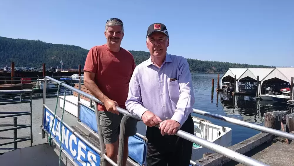 Mike Surrell, left, current owner of Lady Rose Marine Services, met Tuesday with future owner Greg Willmon. (Mike Youds photo)