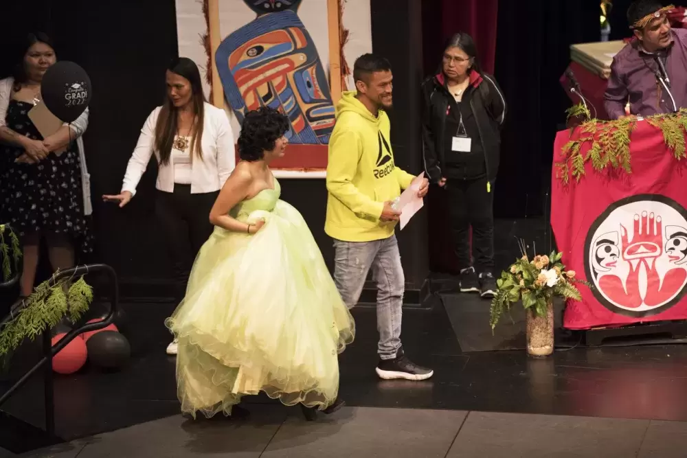 Kylie-Rae Nelson walks the stage during the Nuu-chah-nulth Tribal Council Graduation ceremony held at the Alberni District Secondary School in Port Alberni, on June 11, 2022.