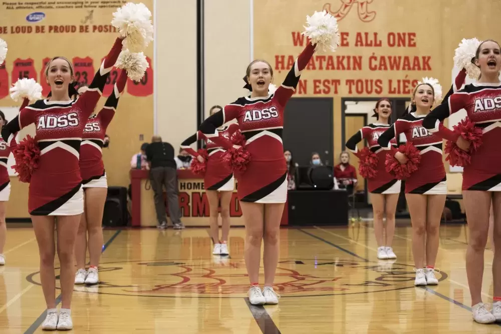 Alberni District Secondary School (ADSS) cheerleaders perform in front of the crowd gathered to support the school's athletes on first night of the 66th annual Totem Tournament, at ADSS in Port Alberni, on March 10, 2022.