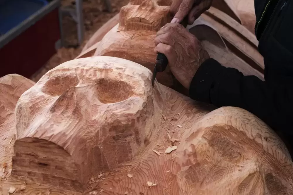 Four skeletons are carved into the totem pole representing  the Missing and Murdered Indigenous Women and Girls, all of the children who never returned home from residential school, the most recent COVID-19 pandemic, along with past pandemics Nuu-chah-nulth peoples have faced, on July 7, 2021.