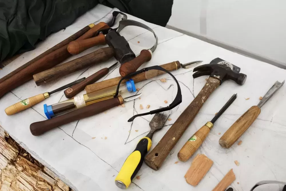 Carving tools are spread out on a work bench at the Tofino Botanical Gardens, on July 9, 2021.