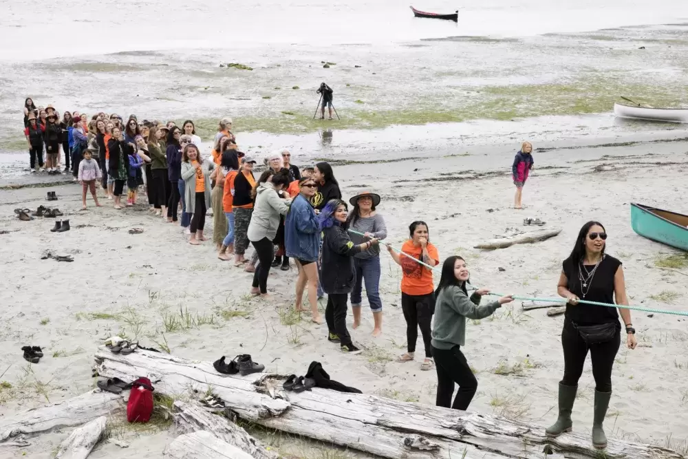 The middle rope was pulled by a long line of women, in Opitsaht, on Meares Island, on July 1, 2022.