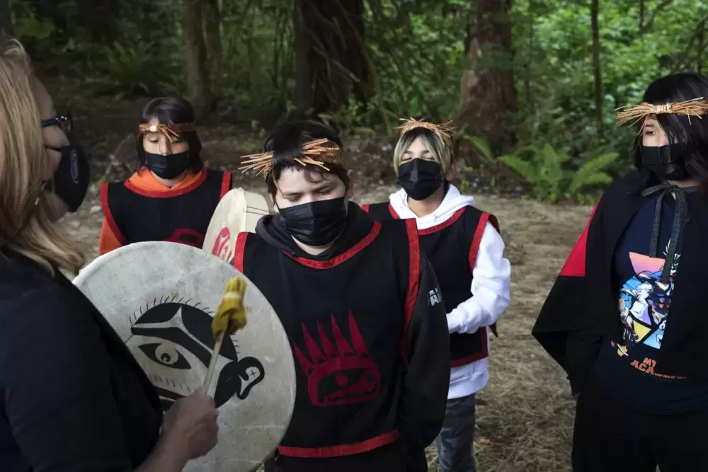 A Grade 5/6 class at Haahuupayak sings together before the blessing ceremony of the school's new outdoor learning space, in Port Alberni, on June 10, 2021.