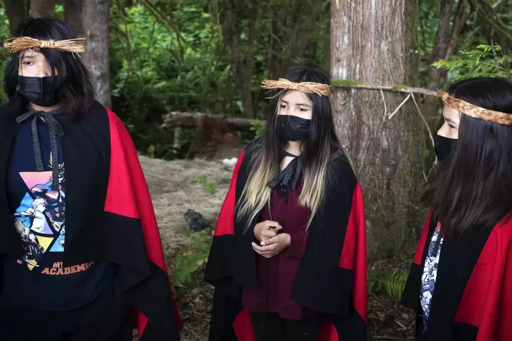 A Grade 5/6 class at Haahuupayak sings together before the blessing ceremony of the school's new outdoor learning space, in Port Alberni, on June 10, 2021.