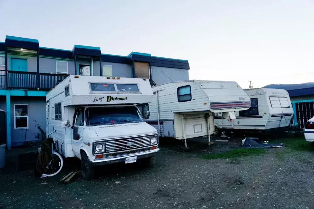 Trailers continue to occupy Randy Brown’s property on Fourth Avenue next to the Wintergreen Apartments where homeless individuals are living. (Karly Blats photo) 