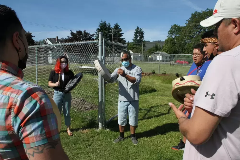 Aaron Watts leads Tseshaht singers in the Welcoming Song.