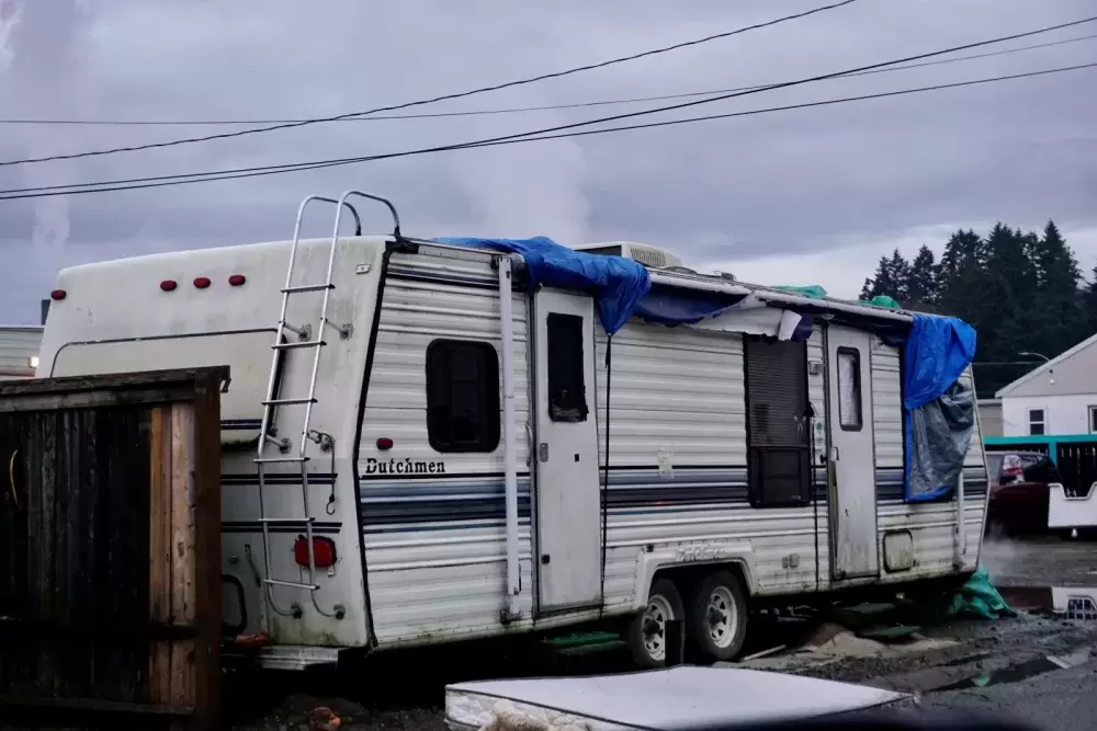 Trailers housing homeless individuals on Randy Brown’s Fourth Avenue property have been ordered to be removed by the City of Port Alberni. (Karly Blats photo)