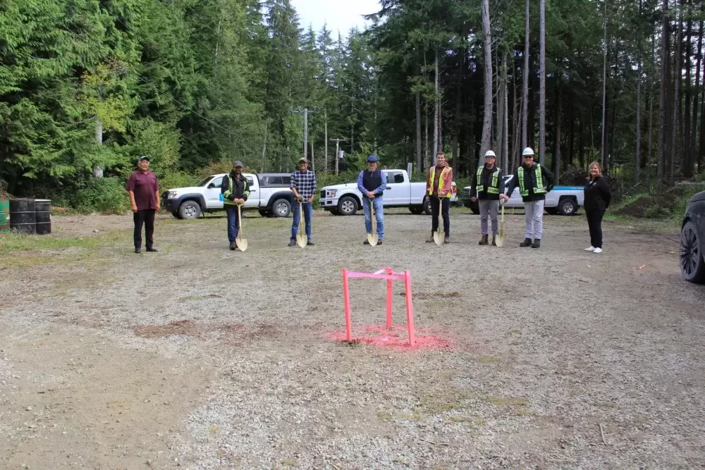 Partners in Huu-ay-aht First Nations’ wastewater treatment project line up at a safe distance for the ground breaking in October (HFN).