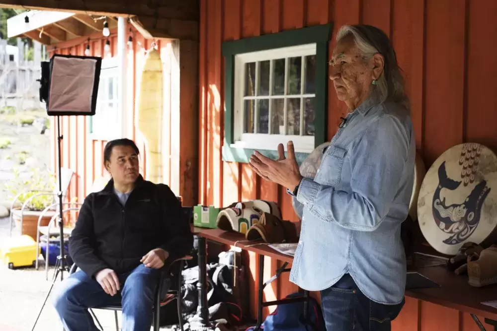 Joe David (right), a founding member of Carving on the Edge Festival, and Gordon Dick film a video segment for this year's virtual festival at the Tofino Botanical Gardens, on March 6, 2021. Photograph by Melissa Renwick