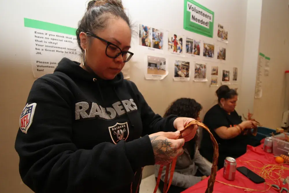 Mowachaht's Crystal Howard weaves cedar.