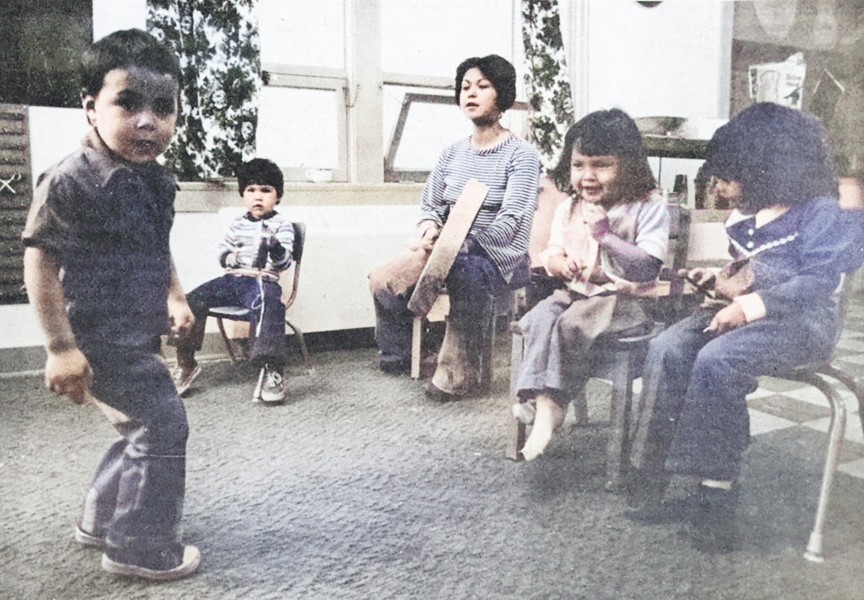 “Jim-Bob” Mack demonstrates his dancing skills at the Ha-ho-payak Play School while his classmates and teacher Anne Robinson lay down the beat. Part of the Ha-Shilth-Sa’s archive of photographs, this was originally printed Nov. 29 , 1976. (Ha-Shilth-Sa colourized archive photo)