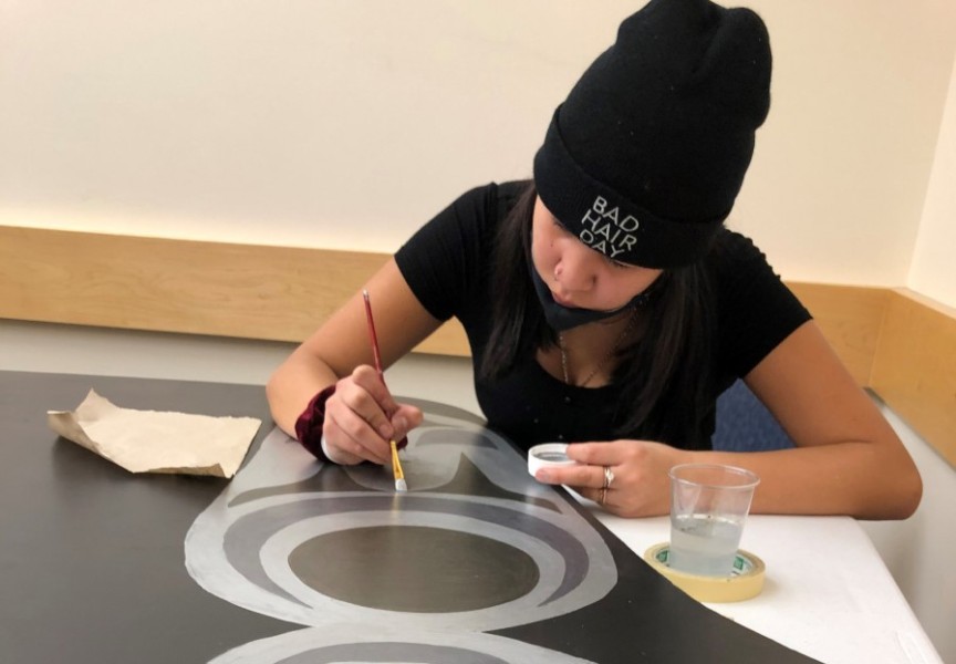 Grade 8 student, Jolene Sam, works on the 2-D canoe at ADSS. (Photo supplied by Geena Haiyupis)