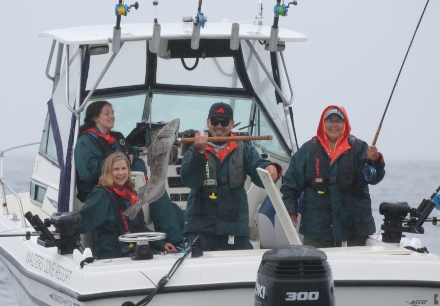 Fishing guide Darian Baker holds a fresh catch hooked by his crew on June 21 offshore from Kyuquot.