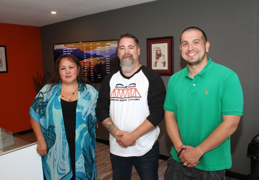 Assistant Manager Tammy Lucas(right),  Manager Ron Kyle and Tseshaht Chief Councillor Ken Watts stand in Orange Bridge Cannabis. (Eric Plummer photo)