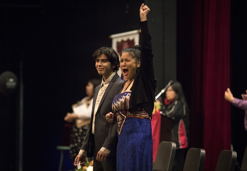 Tyson Whitford-Williams (left) is cheered for while walking the stage at the Nuu-chah-nulth Tribal Council Graduation ceremony held at the Alberni District Secondary School in Port Alberni, on June 11, 2022.