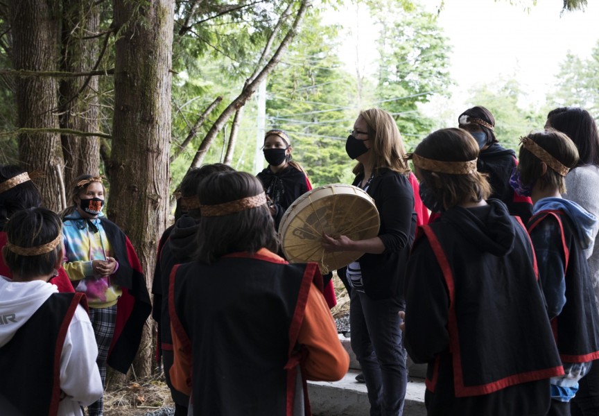 Helen Lucas (centre) and her Grade 5/6 class at Haahuupayak Elementary School sing together before the blessing ceremony of the school's new outdoor learning space, on June 11, 2021.