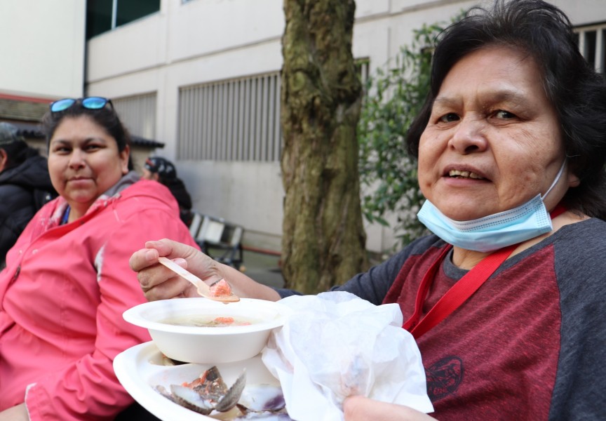 Marilyn Jones of Pacheedaht (right) enjoys the meal with her daughter Kathryn.