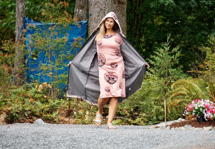 A model showcases an outfit from Ay Lelum- The Good House of Design during a fashion show at the Chims Guest House grand opening event on Aug. 7