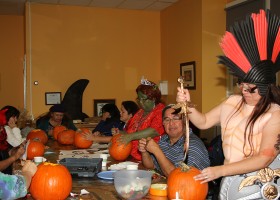 Spartacus carves a pumpkin