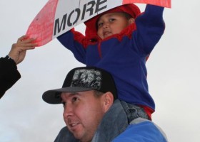 Parents and kids working together about Idle No More