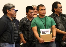 Ahousaht Chief Councillor Curtis Dick holds items that will remind A-in-chut of home and his territory