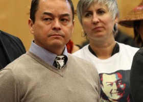 A-in-chut listens intently as the Nuu-chah-nulth Nation speaks. Nancy wears a T-shirt given to her by NCN