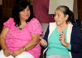 Lisa Watts listens as Julia Lucas describes her vision for a nursery for moms and babies to learn the language together