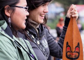 Family members gather to celebrate the Tluu-cha