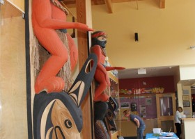 The poles in the reception area of the Ditidaht Community School: Artist was late Art Thompson